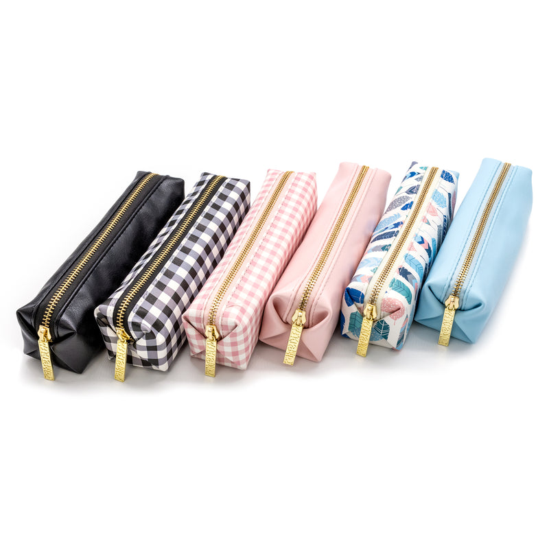 Collection of slim pencil cases, black, buffalo check, ballerina pink check, ballerina pink, feathers and, sky blue.